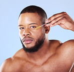 Man, portrait or face oil in studio, aesthetic skincare or beauty dermatology on blue background. Serious black male model, facial cosmetics or dropper of hyaluronic acid, collagen or vitamin c serum