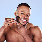 Portrait, man and shave with razor for hair removal, aesthetic skincare and facial cleaning in studio. Happy black male model shaving beard on face with blade, trimmer and cosmetic tool on background