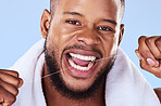 Portrait, man and floss teeth in studio, health dental and self care of gum gingivitis. Face of black male model, thread or cleaning mouth for fresh breath, tooth hygiene or plaque on blue background