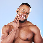 Skincare, portrait of black man with hand on face, studio and luxury skin care morning routine. Dermatology, spa cosmetics and facial beauty glow for wellness, happy model isolated on blue background