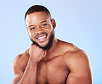 Cosmetics, portrait and black man with skincare, muscle and wellness against a blue studio background. Male person, model and guy with treatment, face and glow with dermatology, aesthetic and health