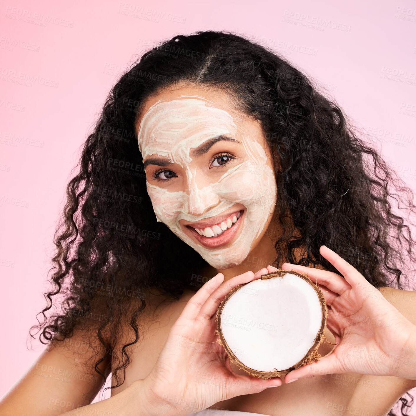 Buy stock photo Beauty, facial mask and portrait of woman with coconut for wellness, skincare and cosmetics on pink background. Dermatology, fruit and female person for organic detox, natural face and glow in studio