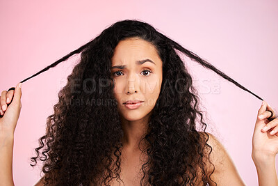 Buy stock photo Hair damage, portrait and confused woman with beauty treatment and hairstyle and problem. Cosmetics, face and female person in studio worried from shampoo care and split ends with pink background