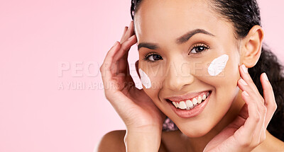 Buy stock photo Face, cream and beauty of a woman with skin care, dermatology and natural glow. Headshot of a young female aesthetic model with space for moisturizer, cosmetics or sunscreen on a pink background