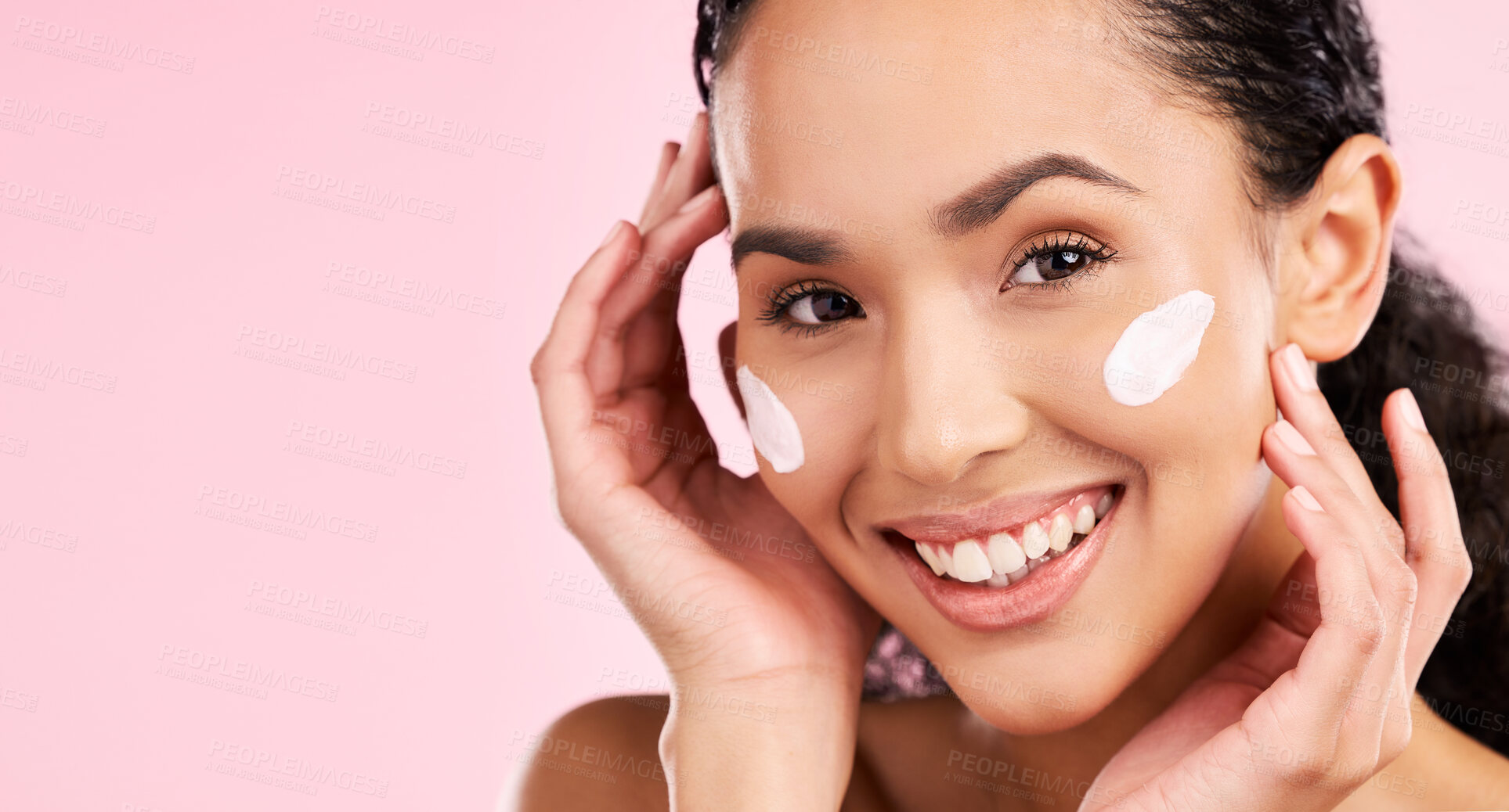 Buy stock photo Face, cream and beauty of a woman with skin care, dermatology and natural glow. Headshot of a young female aesthetic model with space for moisturizer, cosmetics or sunscreen on a pink background