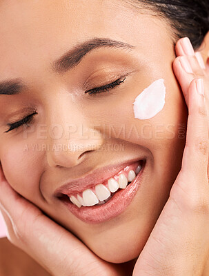 Buy stock photo Beauty, cream and face of a happy woman with skin care, dermatology and natural glow. Closeup of a young female aesthetic model with a smile for moisturizer, cosmetics or sunscreen for wellness