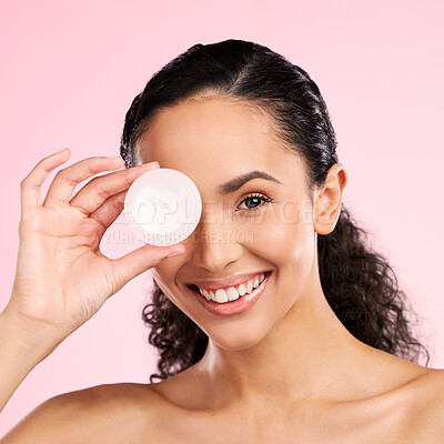 Buy stock photo Face, skincare and happy woman with cream container in studio isolated on a pink background. Portrait, beauty and model smile with moisturizer, sunscreen cosmetic or dermatology product for wellness