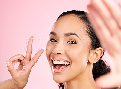 Buy stock photo Selfie, peace sign and happy woman in studio with natural beauty, wellness and cosmetics. Portrait, female person and pink background with makeup and face with skincare and emoji hand gesture of girl