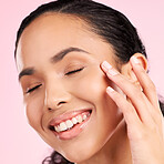 Beauty, skin cream and face of a woman in studio for cosmetics, dermatology and glow. Headshot, moisturizer and natural skincare of a young female aesthetic model on a pink background with a smile