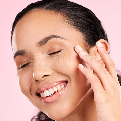 Buy stock photo Beauty, skin cream and face of a woman in studio for cosmetics, dermatology and glow. Headshot, moisturizer and natural skincare of a young female aesthetic model on a pink background with a smile