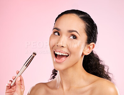 Buy stock photo Cosmetics, makeup and brush with face of woman in studio for foundation, beauty and facial. Skincare, health and self care with female model on pink background for dermatology, glow and product