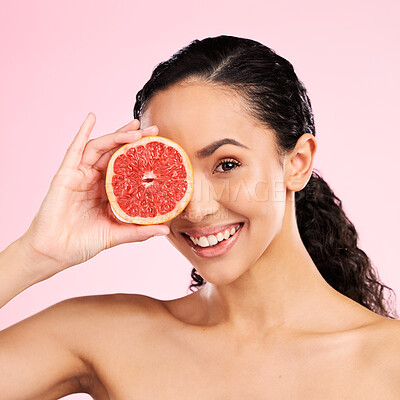 Buy stock photo Beauty, grapefruit and face of a woman with skin care, dermatology and natural glow. Portrait of a happy young female aesthetic model with fruit for vitamin c, cosmetics or healthy diet for wellness