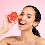Grapefruit, beauty and face of a happy woman with skin care, dermatology and natural glow. Portrait of a young female aesthetic model with fruit for vitamin c, cosmetics or healthy diet for detox