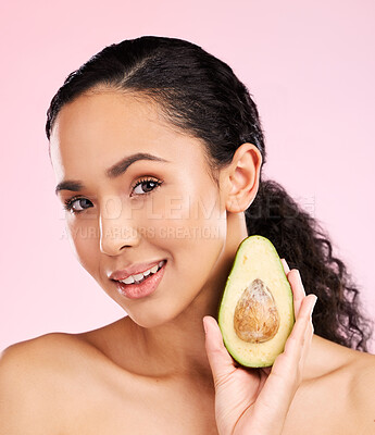 Buy stock photo Face, skincare and woman with avocado in studio isolated on pink background. Portrait, natural cosmetic and model with fruit, food or nutrition for diet, vegan health or omega 3 benefits for wellness