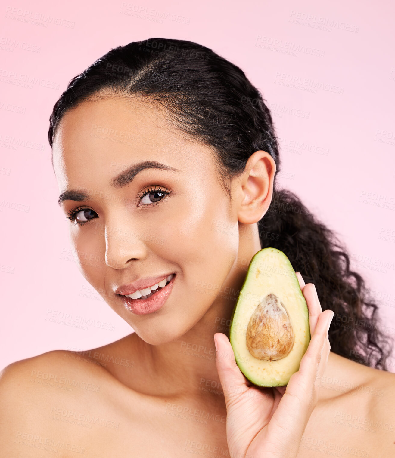 Buy stock photo Face, skincare and woman with avocado in studio isolated on pink background. Portrait, natural cosmetic and model with fruit, food or nutrition for diet, vegan health or omega 3 benefits for wellness