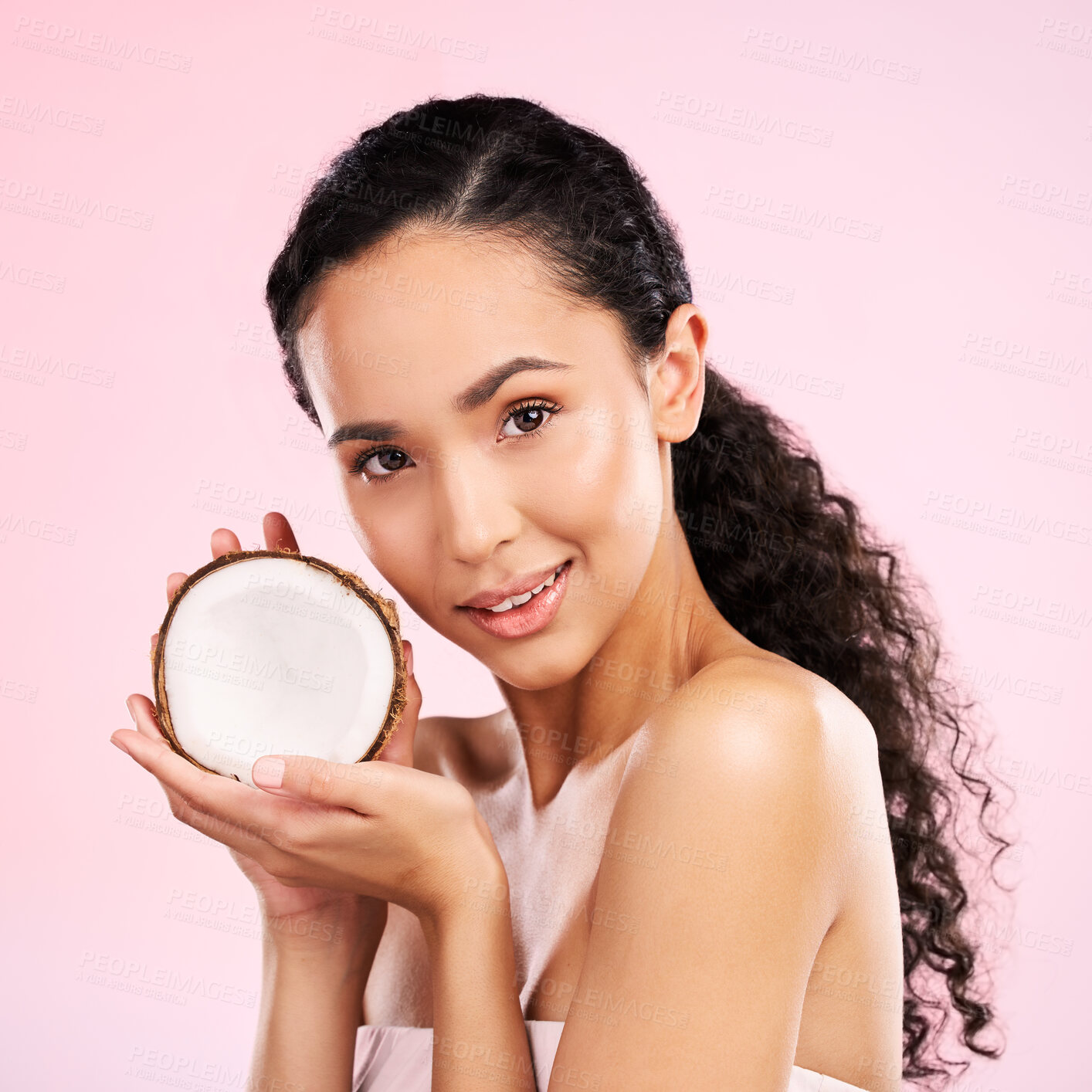 Buy stock photo Woman, portrait and coconut fruit skincare, beauty or vegan cream on pink studio background. Face of african person for natural product and eco friendly dermatology, healthy cosmetics or oil benefits