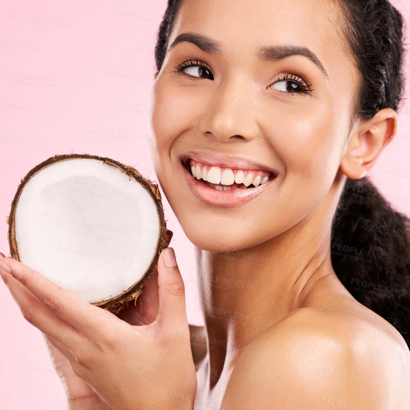 Buy stock photo Coconut, fruit and woman thinking of skincare, beauty or vegan cream on a pink, studio background. Young african person with natural product idea for dermatology and healthy cosmetics or oil benefits