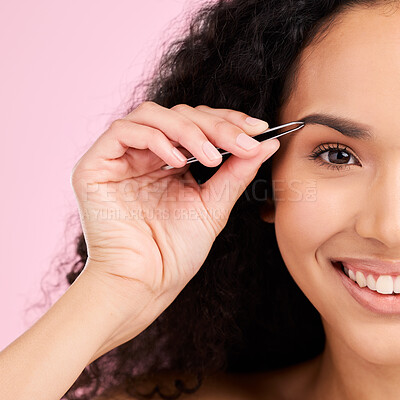 Buy stock photo Face, happy and woman with tweezer for eyebrow, beauty and grooming isolated on a pink background in studio. Natural portrait, facial plucking and hair removal of model for wellness and aesthetic