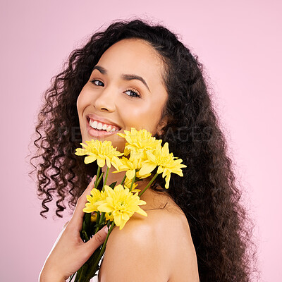 Buy stock photo Skincare, face and beauty of woman with flowers in studio isolated on a pink background. Portrait, smile and natural model with plant, floral cosmetics or organic treatment for healthy skin aesthetic