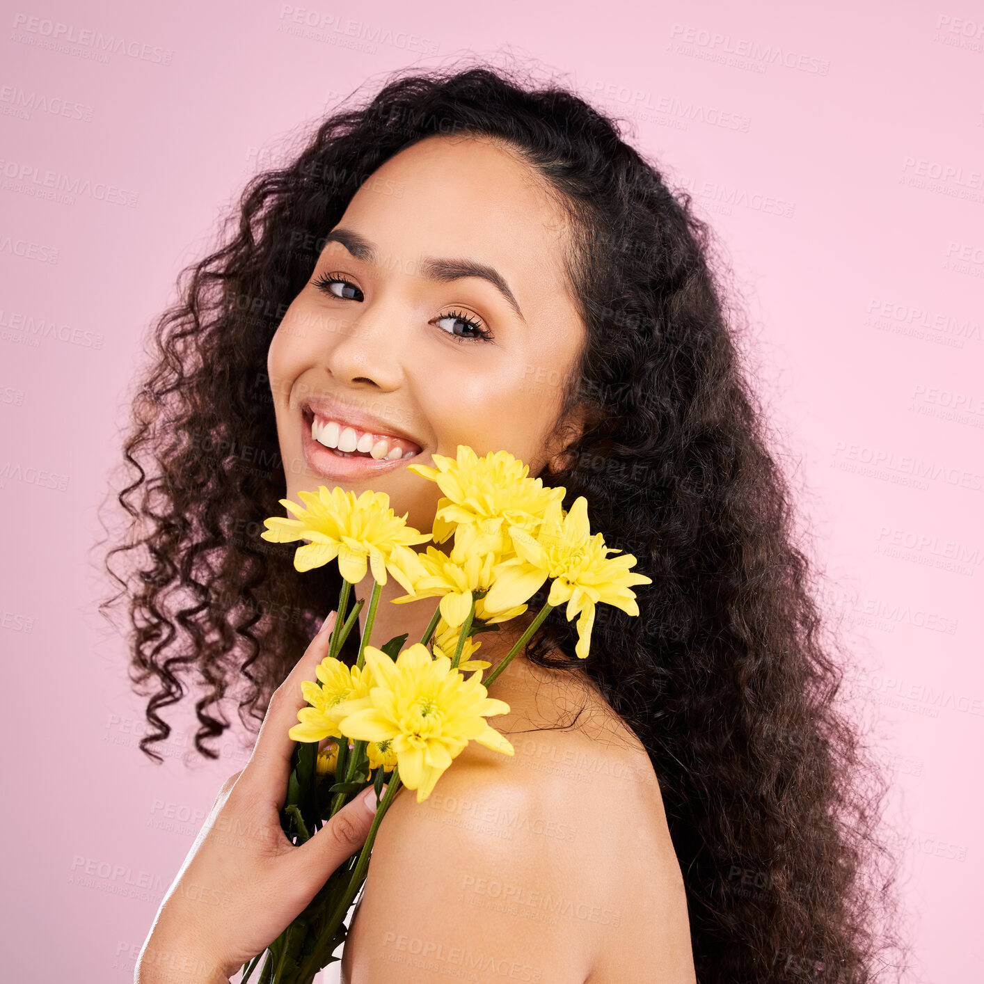 Buy stock photo Skincare, face and beauty of woman with flowers in studio isolated on a pink background. Portrait, smile and natural model with plant, floral cosmetics or organic treatment for healthy skin aesthetic