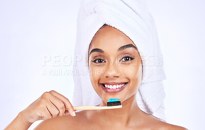 Buy stock photo Toothbrush, dental care and portrait of a woman in a studio for a health and wellness routine. Smile, oral hygiene and headshot of young female model brushing teeth isolated by white background.