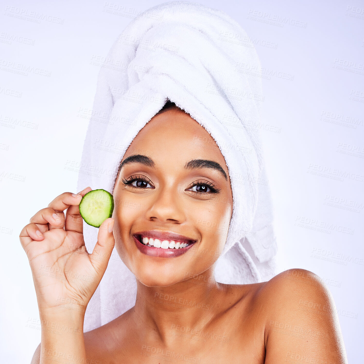 Buy stock photo Skincare, cucumber and portrait of Indian woman in studio happy with detox, wellness or hydration treatment on grey background. Fruit, beauty and face of female smile for natural, vegan or diy facial