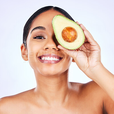 Buy stock photo Skincare, avocado and portrait of Indian woman in studio happy with detox, wellness or omega 3 treatment on grey background. Fruit, face and lady model smile for diy, mask or vitamin c facial beauty