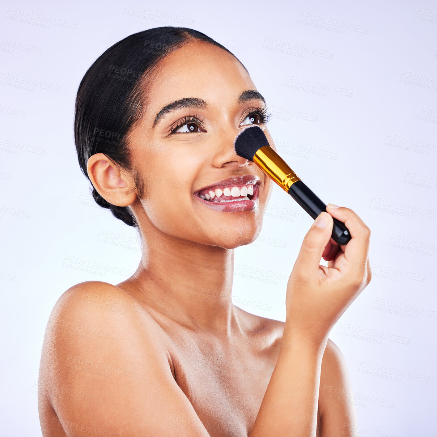 Buy stock photo Cosmetics, makeup brush and beauty of a happy woman in studio for skincare, self care and cosmetology. Skin glow, shine and wellness of a female model with facial application tools for foundation
