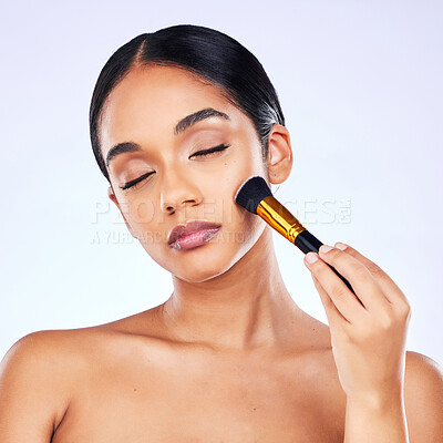 Buy stock photo Makeup brush, beauty and cosmetics of a happy woman in studio for skincare, self care and cosmetology. Skin glow, shine and wellness of a female model with facial application tools for foundation