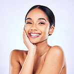 Portrait, aesthetic and skincare with a model woman in studio on a gray background for natural wellness. Face, smile and beauty with a happy young person posing for luxury cosmetics or dermatology