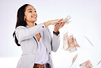 Money, rain and a woman lottery winner in studio on a gray background in celebration of a bonus or promotion. Cash, finance and payment with a happy young female excited about investment growth