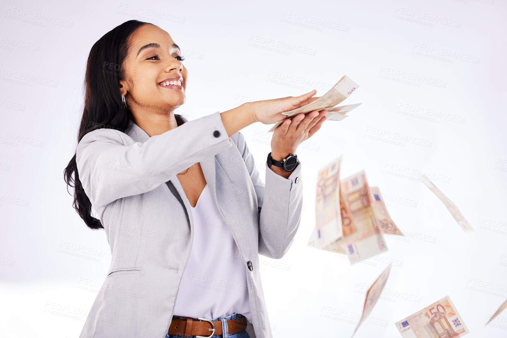 Buy stock photo Money, rain and a woman lottery winner in studio on a white background in celebration of a bonus or promotion. Cash, finance and payment with a happy young female excited about investment growth