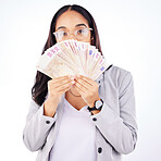 Portrait, money and a woman lottery winner in studio on a gray background in celebration of a bonus or promotion. Cash, eyes and finance payment with a young person in glasses holding euro notes