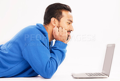 Buy stock photo Man, laptop and relax on studio floor for digital streaming, online show and download subscription. Happy asian male model watch connection on computer technology, internet news and white background