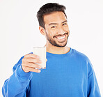 Portrait, man and smile with milk in studio, white background and backdrop for healthy benefits. Asian male model, glass and calcium of smoothie, vanilla milkshake or drinking diet of dairy nutrition