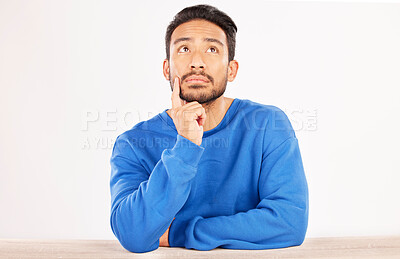 Buy stock photo Choice, thinking and space with man and idea in studio for confused, brainstorming and question. Doubt, solution and choice with asian person on white background for why, opportunity and mockup