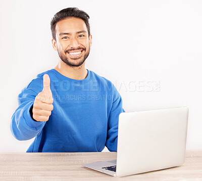 Buy stock photo Portrait, laptop and thumbs up with an IT support man at his desk in studio on a white background. Smile, thank you and yes with a happy male computer engineer working to finish or complete a task