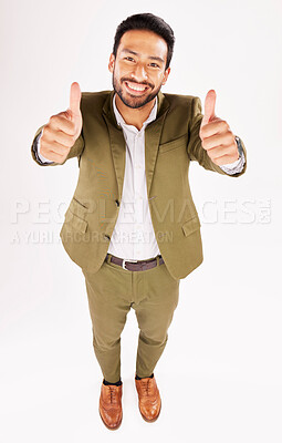 Buy stock photo Thumbs up, portrait and happy business man in studio, white background and trust of success from above. Asian worker, winner and like emoji for feedback, review and vote yes in agreement of support