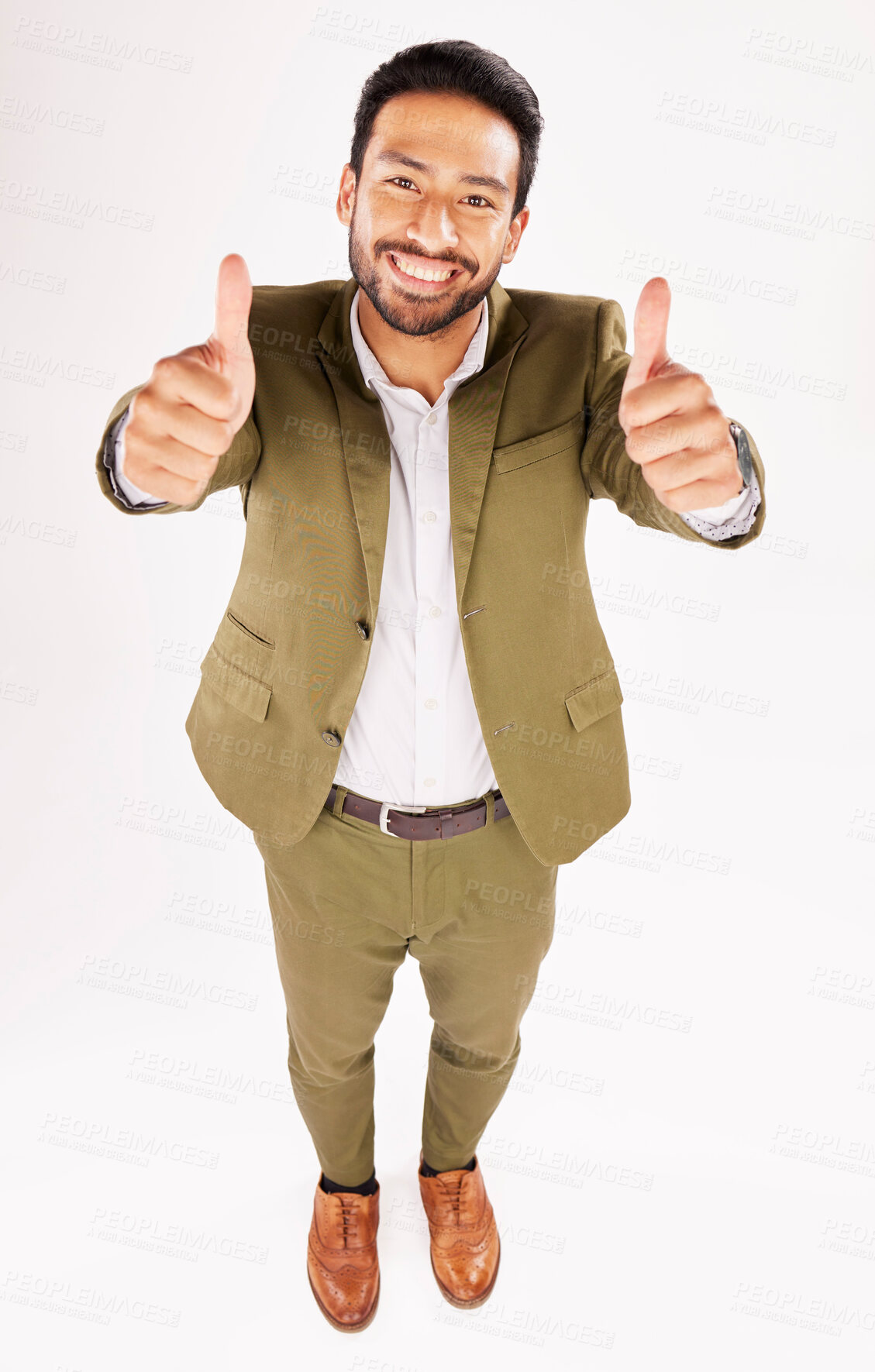 Buy stock photo Thumbs up, portrait and happy business man in studio, white background and trust of success from above. Asian worker, winner and like emoji for feedback, review and vote yes in agreement of support