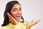 Excited, wow and portrait of a woman on a studio background with mockup for marketing. Happy, advertising and face of a girl or employee with a gesture, surprise and space for a deal or announcement