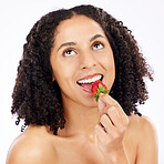 Healthy, eating or happy woman with strawberry in studio on white background for clean diet nutrition. Smile, looking up or girl model thinking of beauty or natural fruits for nutrition or wellness