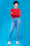 Fashion, smile and portrait of a woman with style and confident isolated in a studio blue background. Casual, outfit and full body of a happy young female person with stylish or trendy clothes