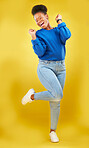 Happy, dance or black woman in studio for celebration, achievement or goal with confidence. Moving, smile or African female model with pride, success or joy for target isolated by yellow background