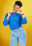 Happy, dance and young woman in studio for celebration, achievement or goal with confidence. Happiness, smile and African female model moving to music, song or playlist isolated by yellow background.