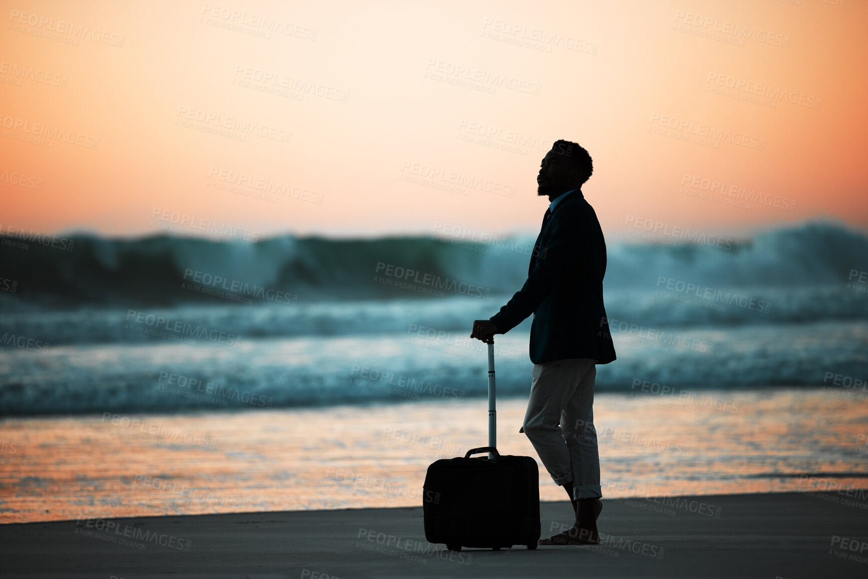 Buy stock photo Sunset, beach and man with suitcase for travel, vacation and break in nature with freedom and solo trip. Ocean, Silhouette, male at the sea at sunrise for holiday, experience and abroad relocation