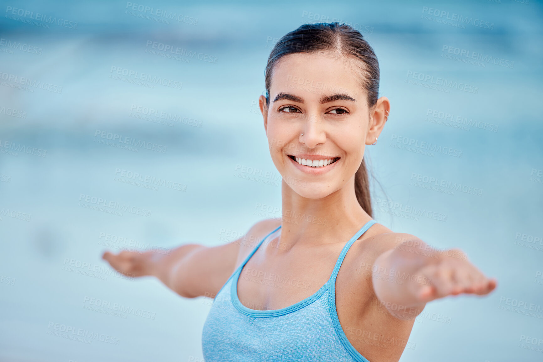 Buy stock photo Fitness, yoga and face of woman by beach with warrior pose for wellness, healthy body and energy. Sports, nature and female person stretching arms for exercise, training and balance workout by ocean