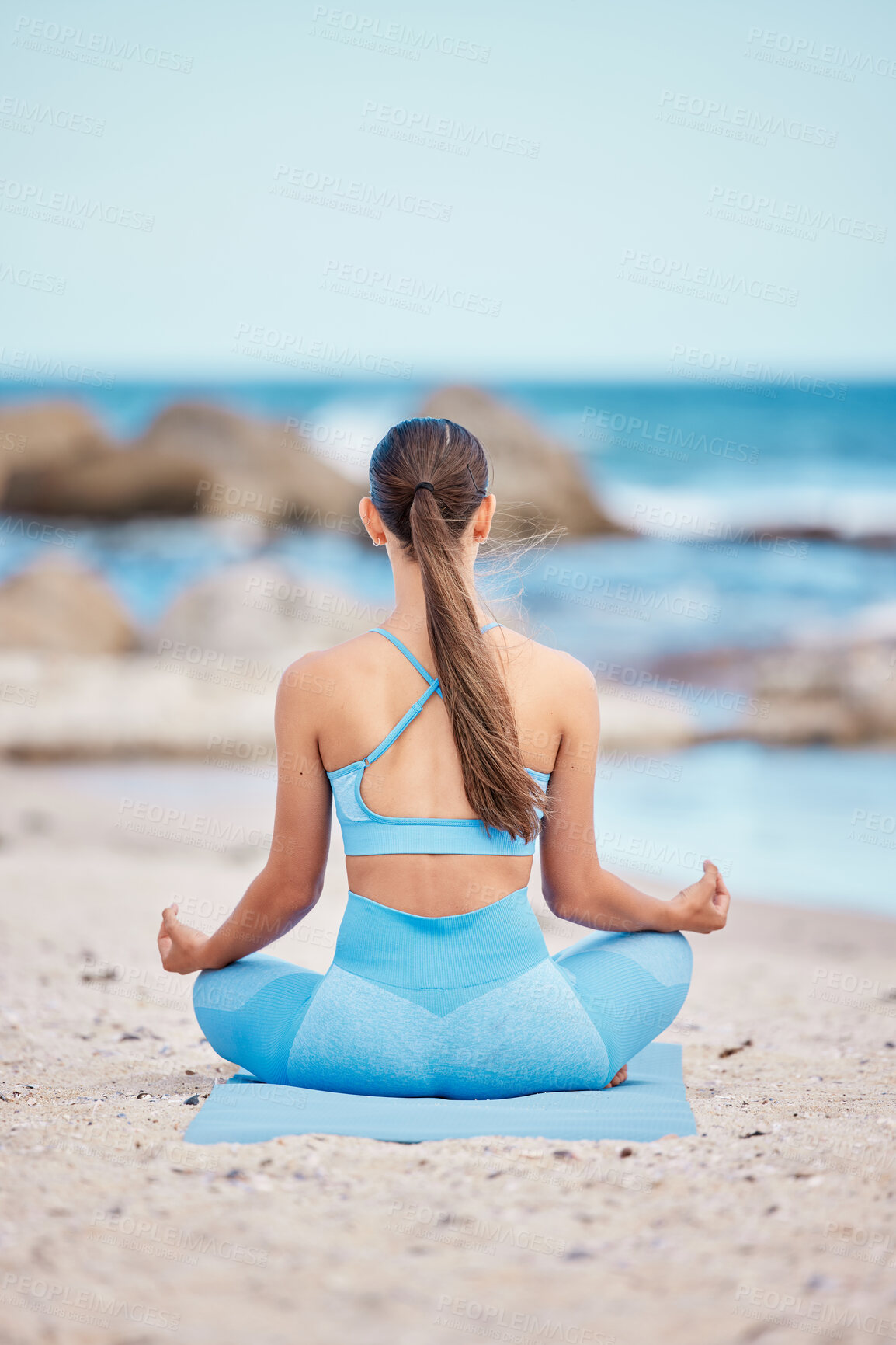 Buy stock photo Meditation, fitness and back view of woman at the beach for workout or training as health, mindfulness and wellness routine. Healthy, body and zen person exercise chakra by doing lotus pose at sea