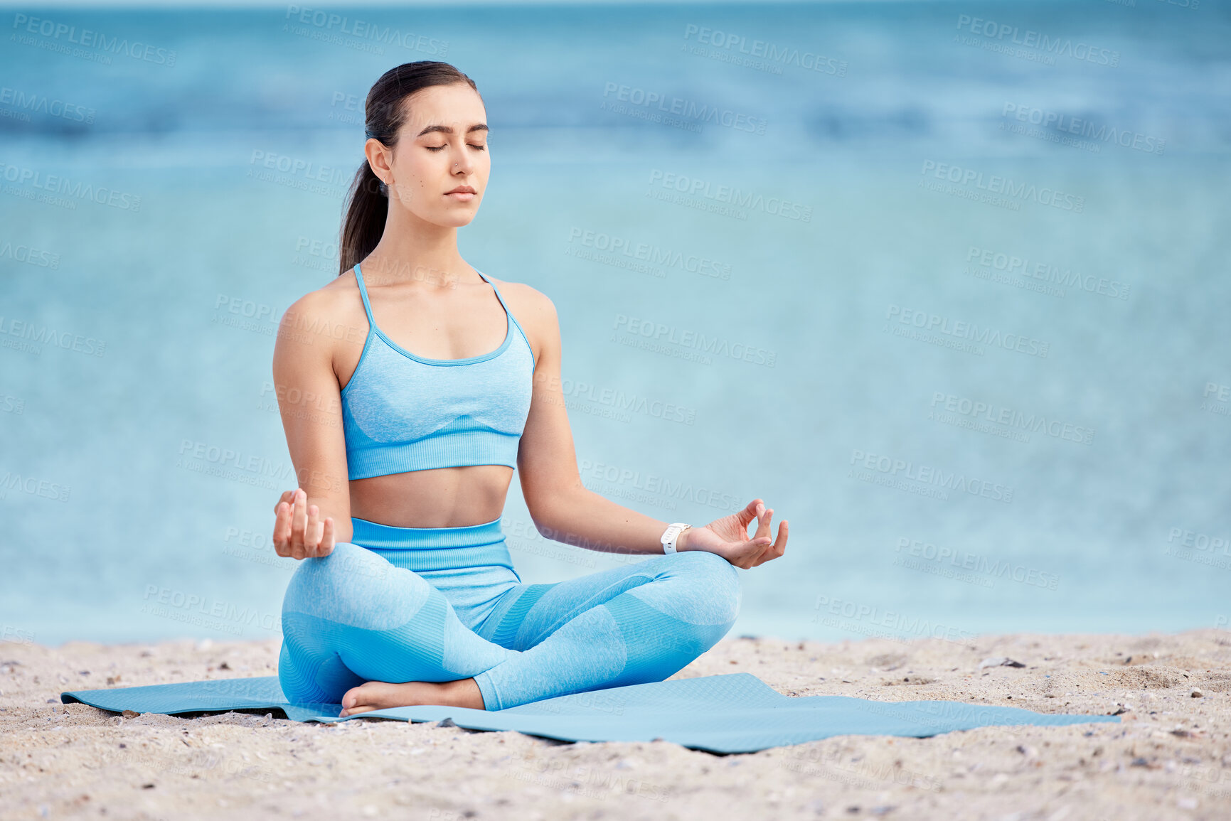 Buy stock photo Meditation, yoga and woman by beach for wellness, healthy body and zen energy by ocean for calm. Mindfulness, nature and female person with crossed legs for balance, training and meditate by sea