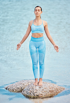 Buy stock photo Woman, yoga and relax on beach rock for meditation, zen or healthy wellness in outdoor fitness. Calm female person or yogi relaxing for inner peace, exercise or workout in awareness on ocean coast