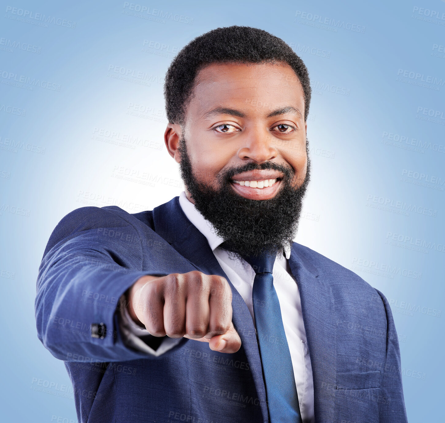 Buy stock photo Portrait, motivation and fist with a business black man in studio on a blue background for trust or support. Leadership, smile and confident with a happy male CEO or manager in a professional suit